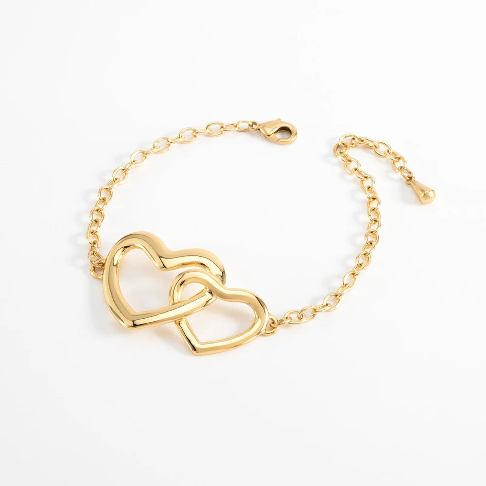 Pulsera en baño de oro con corazones entrelazados lisos