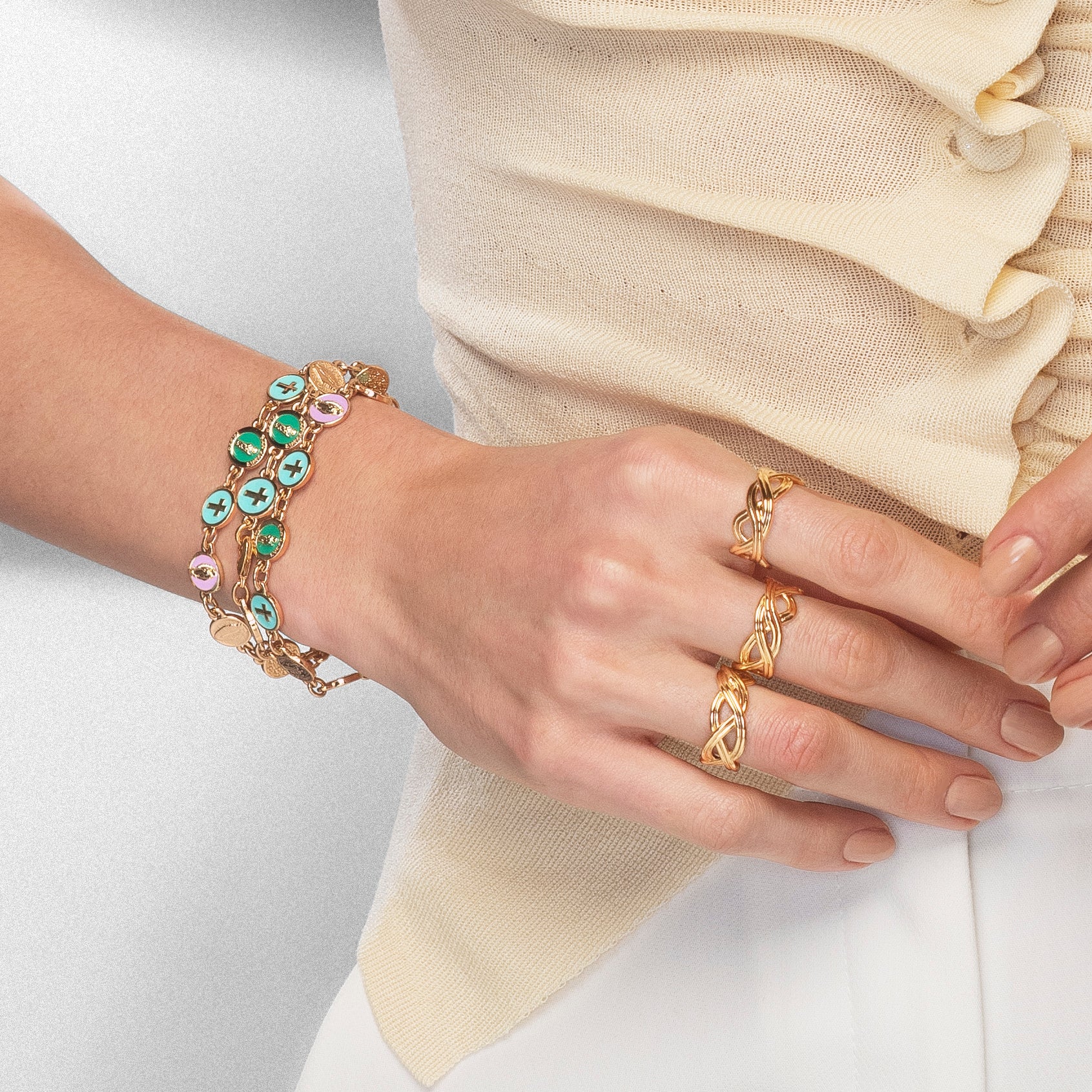 Adjustable bracelet with enameled religious charms