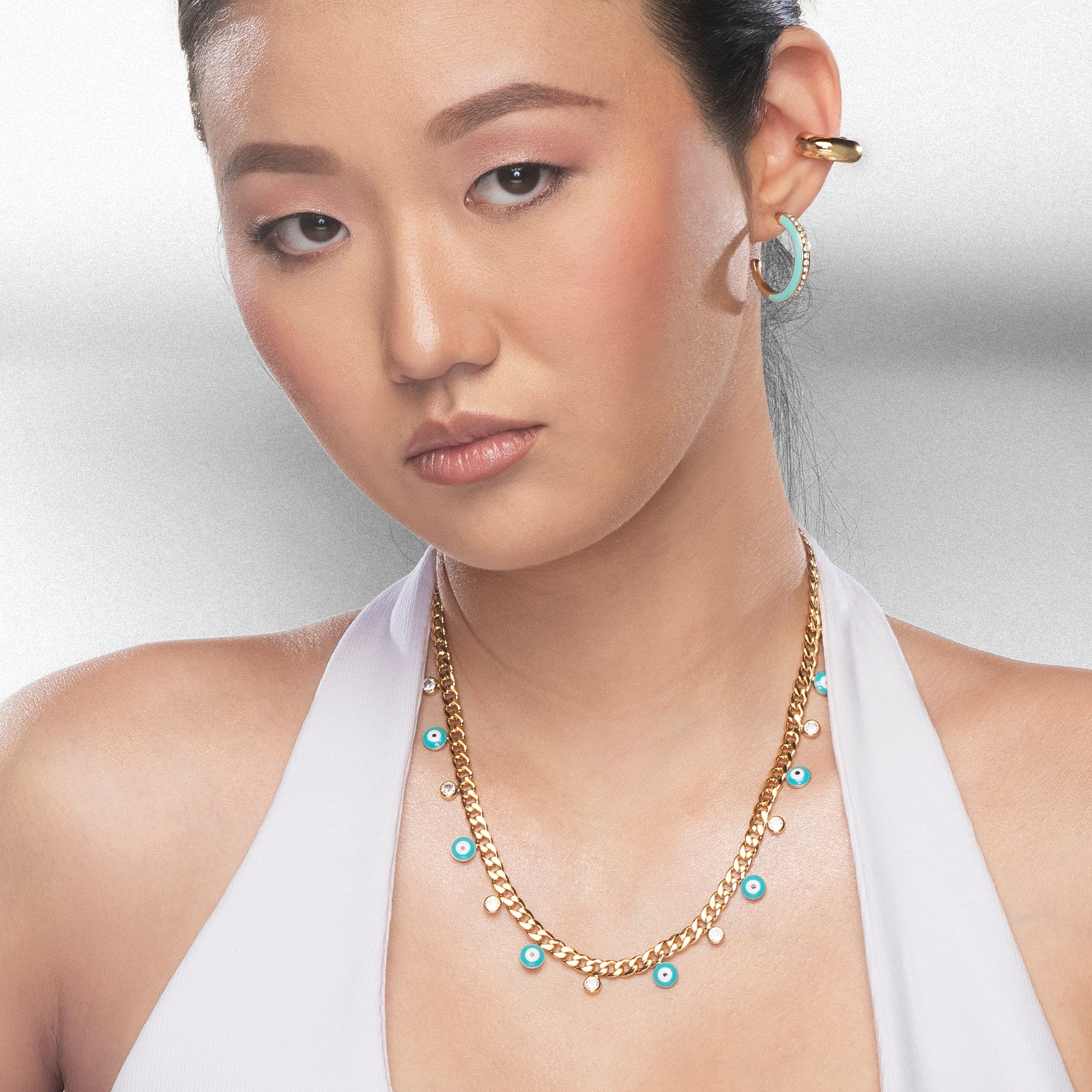 Hoop earrings with aqua green enamel and crystals