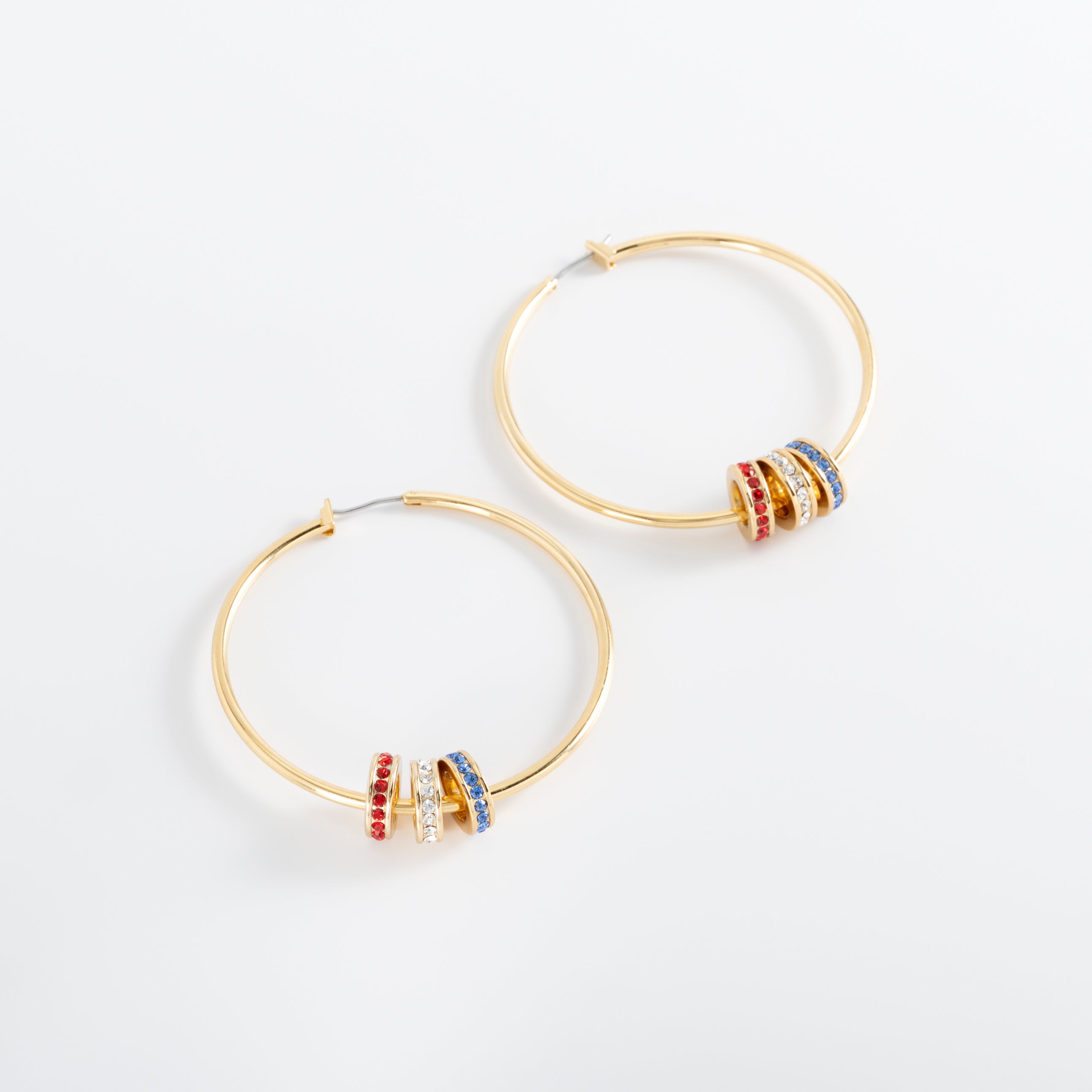 USA. Gold-plated earrings with multicolored charms.