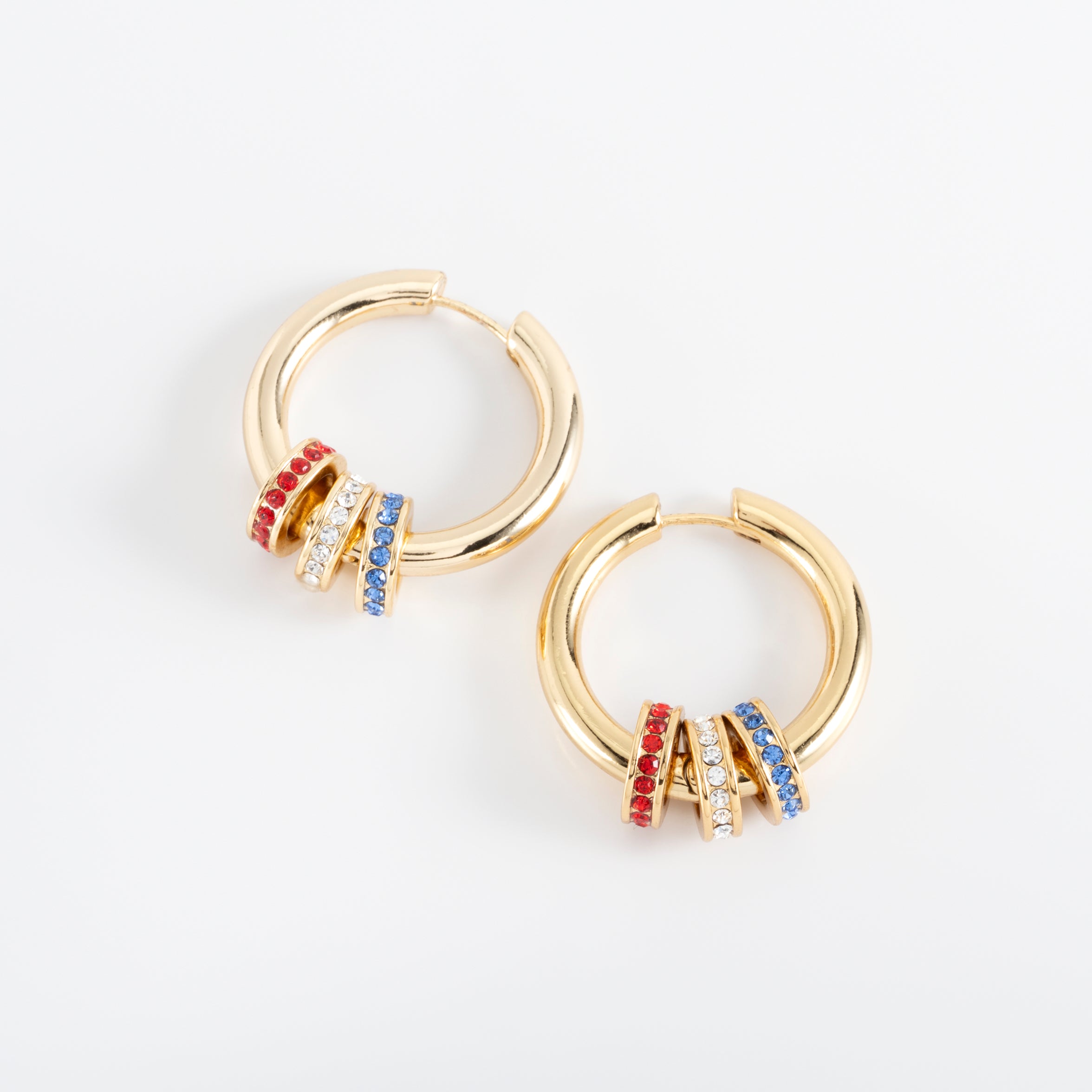 USA. Gold-plated earrings with multicolored charms.